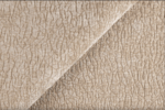 Close-up van beige meubelstof met zachte geweven structuur